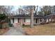 Charming single-story home with a well-maintained lawn and driveway at 2689 Rollingwood Se Ln, Atlanta, GA 30316