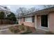Classic brick home with black shutters, neat landscaping, and a welcoming entryway at 2689 Rollingwood Se Ln, Atlanta, GA 30316