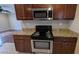 A view of the kitchen area featuring stainless steel appliances and granite countertops at 2689 Rollingwood Se Ln, Atlanta, GA 30316
