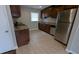 A stylish kitchen showcasing stainless steel appliances, granite counters, and tile floors at 2689 Rollingwood Se Ln, Atlanta, GA 30316