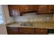 The kitchen features granite countertops and dark wood cabinets at 2689 Rollingwood Se Ln, Atlanta, GA 30316