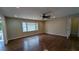 A light-filled living room featuring hardwood floors and a ceiling fan at 2689 Rollingwood Se Ln, Atlanta, GA 30316