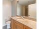 Bathroom featuring granite countertops, a modern faucet, a mirror, and neutral colored walls at 361 17Th St # 1516, Atlanta, GA 30363