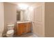Clean bathroom with a granite countertop and modern fixtures with a neutral tiled floor at 361 17Th St # 1516, Atlanta, GA 30363