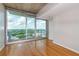 Bedroom with large windows offering breathtaking city views and hardwood floors at 361 17Th St # 1516, Atlanta, GA 30363