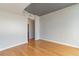 Bright bedroom with hardwood floors, neutral paint, and an open doorway leading to a closet and ensuite bathroom at 361 17Th St # 1516, Atlanta, GA 30363