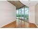 Airy bedroom with floor to ceiling glass windows and hardwood floors at 361 17Th St # 1516, Atlanta, GA 30363