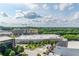 Scenic view overlooking urban development with a construction crane against a backdrop of lush green trees and partly cloudy skies at 361 17Th St # 1516, Atlanta, GA 30363