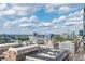 Panoramic city view from above showcasing the vibrant cityscape with blue skies and fluffy clouds at 361 17Th St # 1516, Atlanta, GA 30363