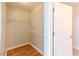 Walk-in closet with white wire shelves and hardwood floors, providing ample storage space at 361 17Th St # 1516, Atlanta, GA 30363