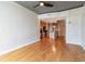 Open concept living room with hardwood floors and kitchen area and view of other rooms through entryways at 361 17Th St # 1516, Atlanta, GA 30363