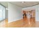 Spacious living room featuring hardwood floors and an open floor plan leading to the kitchen with stainless steel appliances at 361 17Th St # 1516, Atlanta, GA 30363