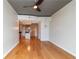Open concept living room with hardwood floors and kitchen area and view of other rooms through entryways at 361 17Th St # 1516, Atlanta, GA 30363