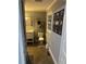 Bathroom with white vanity, toilet, and decorative wall tapestry at 3802 Macland Rd, Hiram, GA 30141
