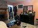 Bedroom featuring a brick fireplace, dresser, and walk-in closet at 3802 Macland Rd, Hiram, GA 30141