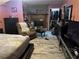 Bedroom featuring a fireplace, recliner, closet, and hardwood floors at 3802 Macland Rd, Hiram, GA 30141