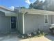 Charming home featuring a black front door adorned with a wreath and gray brick and siding at 3802 Macland Rd, Hiram, GA 30141