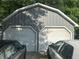 Detached two-car garage provides ample parking and storage space for your vehicles at 3802 Macland Rd, Hiram, GA 30141