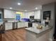 Modern kitchen with white cabinets, stainless steel appliances, granite countertops, and recessed lighting at 3802 Macland Rd, Hiram, GA 30141