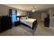 Spacious main bedroom features neutral walls, plush carpeting, and a ceiling fan at 3802 Macland Rd, Hiram, GA 30141