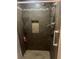 Tiled shower featuring built-in shelves and modern fixtures at 3802 Macland Rd, Hiram, GA 30141