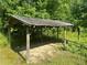 Small covered structure sitting on a wooded property at 3802 Macland Rd, Hiram, GA 30141