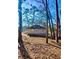Private backyard surrounded by mature trees, offering a serene and peaceful outdoor space at 512 Alpine Way, Marietta, GA 30062