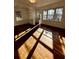 Sun-drenched living area with hardwood floors, built-in shelving and ample natural light at 512 Alpine Way, Marietta, GA 30062