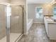 Bathroom boasts tile shower, soaking tub, and double sink vanity at 7644 Watson Cir, Locust Grove, GA 30248