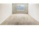 Cozy bedroom features soft carpet and a window with blinds at 7644 Watson Cir, Locust Grove, GA 30248