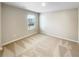 Bedroom featuring carpeting and a window bringing in natural light at 7644 Watson Cir, Locust Grove, GA 30248