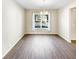 Bright dining room features hardwood floors and a modern chandelier at 7644 Watson Cir, Locust Grove, GA 30248
