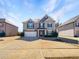 Beautiful two-story home with a two car garage, and well maintained lawn at 7644 Watson Cir, Locust Grove, GA 30248