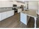 Modern kitchen with granite island, stainless steel appliances, and plenty of cabinet space at 7644 Watson Cir, Locust Grove, GA 30248
