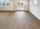 Spacious living room with a French door and lots of natural light at 7644 Watson Cir, Locust Grove, GA 30248