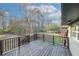 An elevated wooden porch, overlooking a backyard with trees and an outbuilding at 8325 Attleboro Dr, Jonesboro, GA 30238