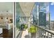 Balcony featuring city views, seating, and access to modern kitchen at 1080 Peachtree Ne St # 2309, Atlanta, GA 30309