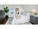 Bright bedroom featuring hardwood floors, neutral paint, and views of the city at 1080 Peachtree Ne St # 2309, Atlanta, GA 30309