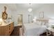 Relaxing bedroom with a calming color palette and a view to the bath at 1080 Peachtree Ne St # 2309, Atlanta, GA 30309