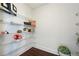 Walk-in closet featuring metal shelving and hardwood floors at 1080 Peachtree Ne St # 2309, Atlanta, GA 30309