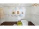 Spacious walk-in closet featuring custom shelving and hardwood floors at 1080 Peachtree Ne St # 2309, Atlanta, GA 30309