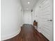 Hallway with hardwood floors, white trim, and doors at 1080 Peachtree Ne St # 2309, Atlanta, GA 30309