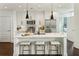 Contemporary kitchen with quartz countertops, stainless steel appliances and an island with barstool seating at 1080 Peachtree Ne St # 2309, Atlanta, GA 30309