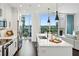 Modern kitchen with white cabinets, quartz countertops, an island, and a view of the city at 1080 Peachtree Ne St # 2309, Atlanta, GA 30309