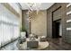 Grand lobby with modern lighting, elegant seating, and stylish architectural details at 1080 Peachtree Ne St # 2309, Atlanta, GA 30309