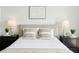 Main bedroom with neutral decor, plush pillows, and two side tables with lamps at 1080 Peachtree Ne St # 2309, Atlanta, GA 30309