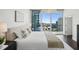 Main bedroom featuring balcony access, hardwood floors, and ensuite bath at 1080 Peachtree Ne St # 2309, Atlanta, GA 30309