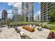Beautiful outdoor lounge area featuring landscaping, comfortable seating, and a fire pit at 1080 Peachtree Ne St # 2309, Atlanta, GA 30309