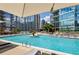 Beautiful outdoor pool featuring comfortable seating, city views, and a lush courtyard at 1080 Peachtree Ne St # 2309, Atlanta, GA 30309