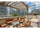 Stylish rooftop deck with an outdoor kitchen, comfortable seating, and city views at 1080 Peachtree Ne St # 2309, Atlanta, GA 30309